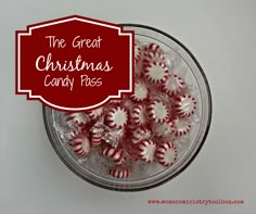 a glass bowl filled with red and white candy canes