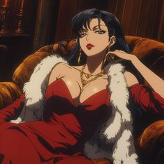 a woman sitting on top of a couch in a red dress and fur stoler