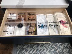 an open drawer containing several different types of sugars and other items that are labeled with the word sugar