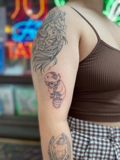 a woman with a tattoo on her arm