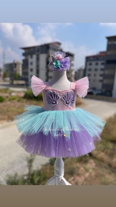 Along with the dress, a mermaid themed hair clip is sent as a gift. 🎁 Handmade dresses for your baby are prepared with soft cotton lining. It has a zipper on the back, very easy and comfortable to wear. The hologram mermaid is made with sequins.  👉🏻 you can leave a message for more questions  👉🏻 It is a handmade dress that we can prepare for the person. Very dense tulle layers are used, very fluffy, personalized color options are available, you can personalize  ✈️Delivery to many countries Costume Mermaid, Girl Party Dress, First Birthday Dress, Ariel Dress, First Birthday Dresses, Dress Baby Girl, Mermaid Costume, Handmade Dress