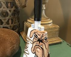 a knife holder with an image of a dog on it next to a loaf of bread