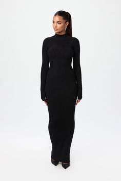 Our soft-to-the-touch ribbed-knit sweater maxi dress is designed with a turtleneck, long fitted sleeves, and a playful ribbed design and v-waist to accentuate your shape. Pair with your favorite flats, boots or heels. Knits Collection Import 52% Viscose, 27% Polyester, 21% Nylon Model wears size XS True to size Flats Boots, Ribbed Maxi Dress, Knit Maxi Dress, Fitted Sleeves, Swim Shop, Maxi Knit Dress, Dress Jewelry, Long Sleeve Midi Dress, Lace Knitting