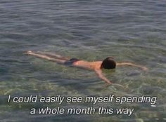 a man swimming in the water with his back turned to the camera, saying i could easily see my self spending a whole month this way