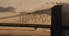 an image of the golden gate bridge at sunset with words spelled out in english on it