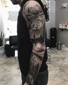 a man with a deer tattoo on his arm