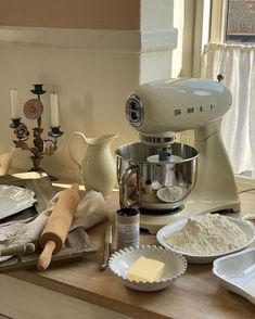 the kitchen counter is cluttered with baking ingredients