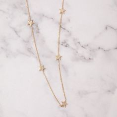 "14k Solid Gold Diamond or Cz Star Necklace, 1 2 3 4 5 Celestial Dainty Stars Necklace, Station Gold Star Necklace, is a great gift for Christmas, Valentine's day and the perfect gift for her. Stars are fixed to the chain Material: Solid Gold, real gold (not gold filled or no gold plated) Karat: 14 Karat Gold (585), 18 Karat Gold (750) Star Pendant height: 6.42 mm Star Pendant Width: 6,10 mm Chain Length - 15 inches adjustable 14 inches Chain Length - 16 inches adjustable 15 inches (choker) Chai Handmade Star-shaped Yellow Gold Necklaces, Dainty Star-shaped 14k Gold-filled Necklace, Delicate Yellow Gold Star Necklace, 14k Gold Star-shaped Necklace With Diamond Accents, Delicate Star-shaped Yellow Gold Necklace, Star Necklace Gold, Star Pendant, Perfect Gift For Her, Gold Stars