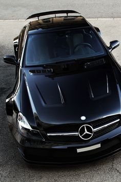 a black sports car parked on the street