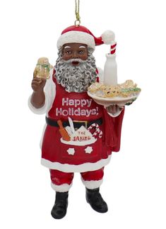 a christmas ornament with a santa clause holding food