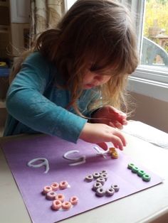 Practicing numbers couldn't be more fun than when you're playing with glue and Fruit Loops! When teaching little kids you always need to find fun new ways to keep their interest. Gluing things to paper is high on the list in our house! All we needed was construction paper white glue and colorful Fruit Loops. I wrote the numbers on the paper with the glue and Annika went to town placing the cereal on the glue. Activity Numbers, Momma Bear, Fruit Loops, Numbers Preschool, Tot School, Preschool Curriculum, Preschool At Home, Preschool Lessons, Toddler Learning Activities