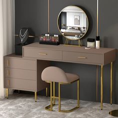 a desk with a mirror, stool and other items on it