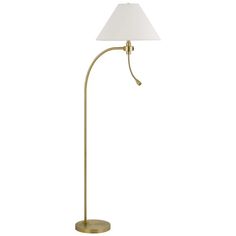 a brass floor lamp with a white shade