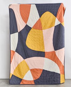 colorful patchwork quilt in navy blue, mustard yellow, orange, blush pink and natural white made with organic cotton & embroidered in India Graphic Quilt Patterns, Color Wheel Quilt, Cute Quilt Patterns, Square Quilt Patterns, Contemporary Patchwork, Sunset Quilt, Minimalist Quilt, Scandinavian Quilts, Abstract Art Quilt