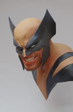 a close up of a statue of a man wearing a batman mask with his mouth open