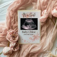 a baby announcement card with pink flowers on the bottom and an image of a woman's breast