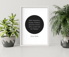 a black and white photo with a quote on it next to two potted plants