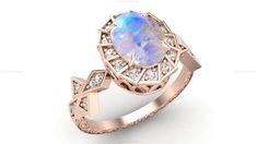 a ring with an oval opal and diamonds on the sides, set in 18k rose gold