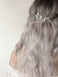 the back of a woman's head wearing a bridal hair comb