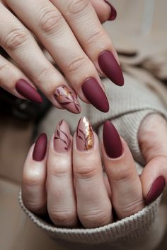 Embrace the cozy spirit of autumn with these stunning matte fall nail ideas that bring a touch of elegance to your look. Picture deep burgundy and rustic orange shades, perfectly muted for a sophisticated finish. These nails not only celebrate the changing season but also add a trendy twist to your style. Get ready to flaunt your fall vibes and inspire others with this chic matte design! Fall Season Nails Matte, Maroon Matte Nails Design, Autumn Nails Burgundy, Matte Burgundy Nails Design, Matte Fall Nail Designs, Fall Matte Nail Designs, Terracotta Nails Designs, Matte Autumn Nails, Nails Burgundy Design