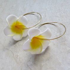 Plumeria Flower Hoops Fun Hawaiian white and yellow plumeria flowers on 14k gold fill endless hoops. Hoops approx. 50mm. Shop~ http://www.etsy.com/shop/HanaMauiCreations?ref=pr_shop_more International buyers please read our shipping policies before ordering~ POLICIES~ https://www.etsy.com/shop/HanaMauiCreations/policy?ref=shopinfo_policies_leftnav Summer Gold Hoop Flower Earrings, Gold Hoop Flower Earrings For Summer, White Flower-shaped Hoop Earrings, White Flower-shaped Hoop Earrings With Ear Wire, White Flower Shaped Jewelry For Beach, Handmade White Flower Hoop Earrings, Handmade White Hoop Flower Earrings, White Small Hoop Jewelry For The Beach, Gold Hoop Earrings For Summer Wedding