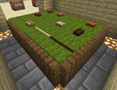 an image of a table in the middle of a room with grass and rocks on it