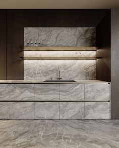 a kitchen with marble counter tops and cabinets