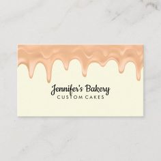 a business card with chocolate drips on the bottom and gold foil lettering that reads,'custom cakes '