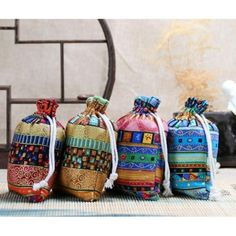 four colorful bags sitting on top of a table