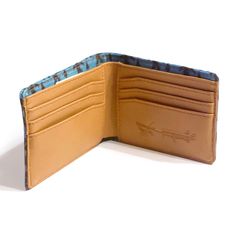 The important thing is that you believe in yourself! Bigfoot sure does. He marches proudly across this pattern with Pine Trees behind him on a mint blue-green canvas. Our compact and thoughtfully designed bifold wallet holds up to 8 cards, includes a cash slot and a zippered change compartment. -Measures 4.4" x 3.4" closed and .75" thick empty at the thickest point -Embossed Gar logo -Zipper change compartment -8 card slots -Cash sleeve -Cotton canvas with protective coating and vegan leather Bigfoot Gifts, Mint Blue, Believe In Yourself, Pine Trees, Bifold Wallet, Cat Nap, Leather Accessories, Wallet Men, Aqua Blue