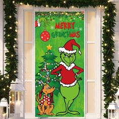 the grinch door cover is decorated with christmas lights and garlands, as well as an image of a dog