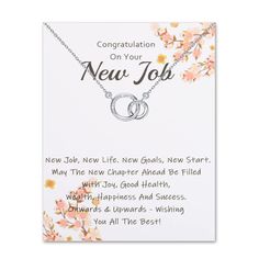 a card with the words congratulations on your new job and two rings hanging from it