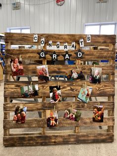 a wooden pallet with some pictures on it and the words congratulations grad spelled in small letters