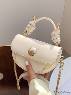 Trendy Beige Bag With Chain Strap, Gold Shoulder Bag With Chain Detail, Trendy Top Handle Shoulder Bag With Chain, Trendy Beige Shoulder Bag With Chain Strap, Trendy Clutch Bag With Chain Strap, Daily Use Gold Shoulder Bag With Gold Chain, Trendy Top Handle Bag With Chain, Gold Shoulder Bag With Gold Chain For Daily Use, Trendy Handheld Bag With Gold-tone Hardware