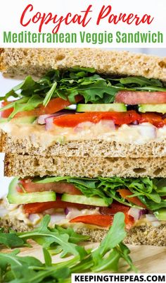 a close up of a sandwich with lettuce and tomatoes