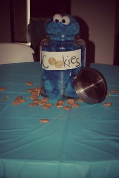 cookie jar with cookie cookies in it sitting on a table