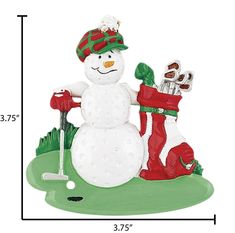 a christmas ornament with a snowman holding golf clubs and a red boot