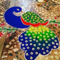 a peacock painted on the ground with flowers