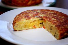 the omelet is cut in half and ready to be eaten on the plate