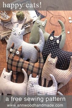 there are many different cat pillows on the floor with text that reads happy cats, a free sewing pattern