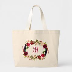 a floral monogrammed tote bag with the letter m