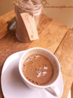 a cup of hot chocolate sits on a saucer