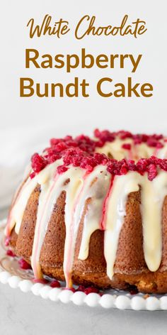 a white chocolate raspberry bundt cake on a plate with the words, white chocolate raspberry bundt cake