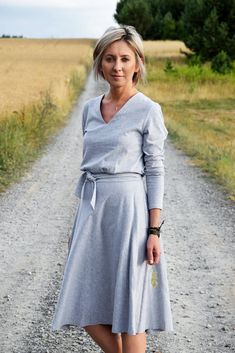 Cotton, flared dress, the most fashionable this season! Midi length, binding at the waist, long sleeves and V-neck ... an absolute hit! A simple and very feminine dress suitable for many occasions. Size - dimensions of item (length/bust/waist/sleeve) EU 34 - XS (116/88/68/59) 36 - S (116/92/72/59) 38 - M (117/96/76/60) 40 - L (118/100/80/61) 42 - XL (118/104/84/61) dimensions in cm. US - UK - EU/DE 4 - 6 - 34/XS 6 - 8 - 36/S 8 - 10 - 38/M 10 - 12 - 40/L 12 - 14 - 42/XL If you have a problem with Grey Cotton Dress, Elegant Cotton Dress, Dress For Work, Grey Midi Dress, Dress Women Elegant, Flared Dress, Cotton Midi Dress, Dress With Belt, Feminine Dress