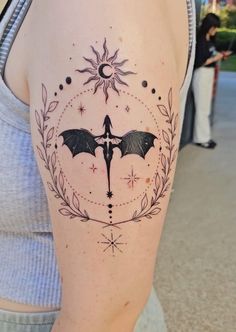 a woman with a bat tattoo on her arm