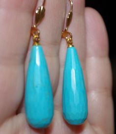 Quality 14k gf 45mm large chinese turquoise tear drop 25ctw lever back earrings vintage gorgeous large pair of 14k gold filled quality sleeping beauty color chinese carved turquoise lever back earrings a+ quality diameter of tear drops: 11 mm in widest area from top to bottom 48 mm you are buying from a multi listing. every pair is a bit different based on the nature of turquoise. if you need a photos of the exact pair, plesae let me know and i will send you additionsl photos. gorgeous coloring Turquoise Teardrop Faceted Jewelry, Turquoise Teardrop Faceted Earrings, Faceted Turquoise Teardrop Earrings, Turquoise Faceted Teardrop Earrings, Sleeping Beauty Turquoise, Leverback Earrings, Turquoise Color, Vintage Earrings, Gold Filled