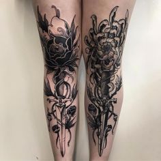 the legs are covered in black ink and have flowers on them, as if they were tattoos