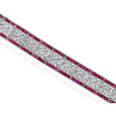 The combination of diamonds and rubies in an Art Deco-inspired design with 18 karats white gold, incredibly luxurious. Rubies are one of the most sought-after gemstones, and the choice of a color-signature for this glamorous piece must make it truly exceptional. This piece fit for a celebration, the craftsmanship and design seem to create a beautiful play of light and style. What's the occasion or inspiration behind such a magnificent creation?Jewelry Details Item Number: 47719Metal Type: 18kt W Ruby Bracelet Gold, Ruby Bracelets, Ruby Bracelet, Jewelry Details, Ruby Gemstone, Art Deco Inspired, French Style, Item Number, Fashion Bracelets