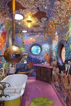 the bathroom is decorated with many different colors and designs, including an oval window in the ceiling