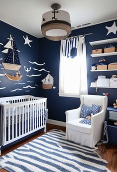 a baby's room decorated in blue and white